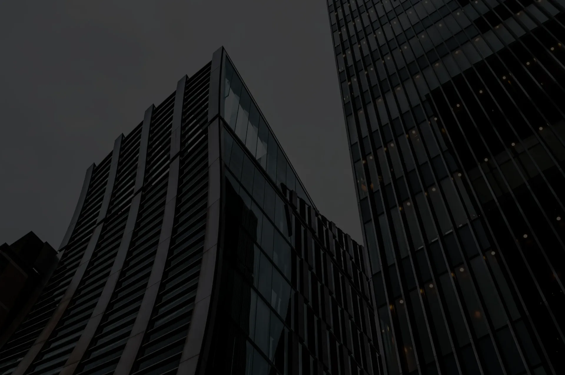 Glass office towers at dusk